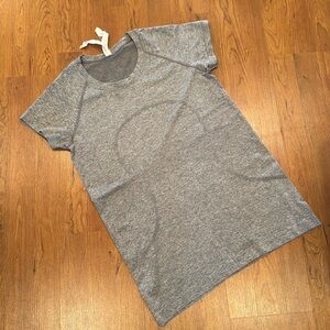 Women’s lululemon swiftly tech tee size 10.  Like new.